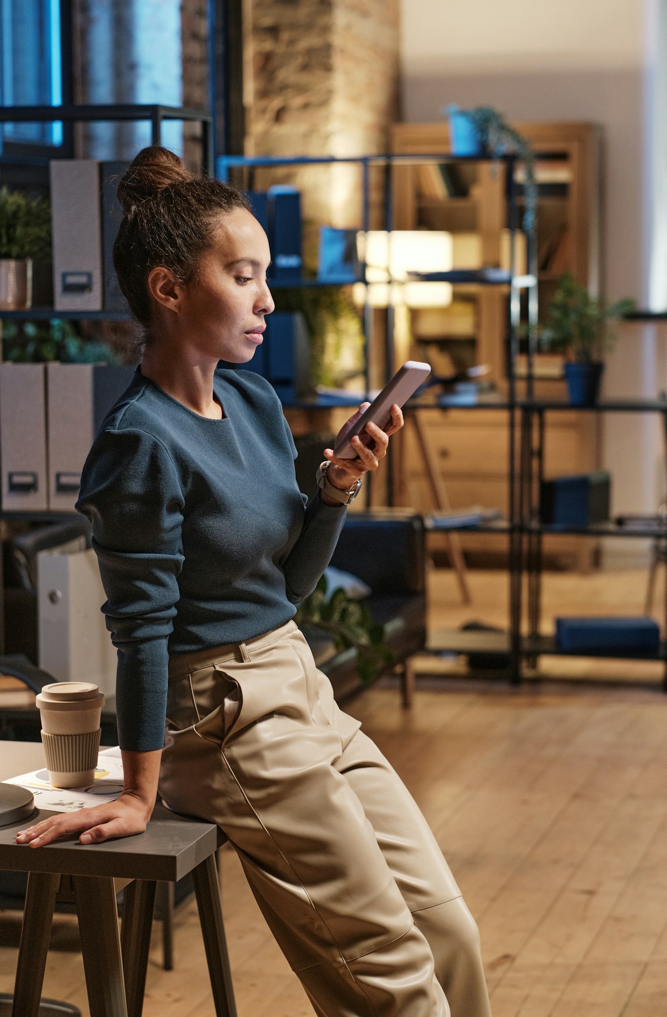 Manager of company scrolling on phone